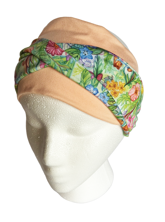Wildflower twist headband on a coral secondary color
